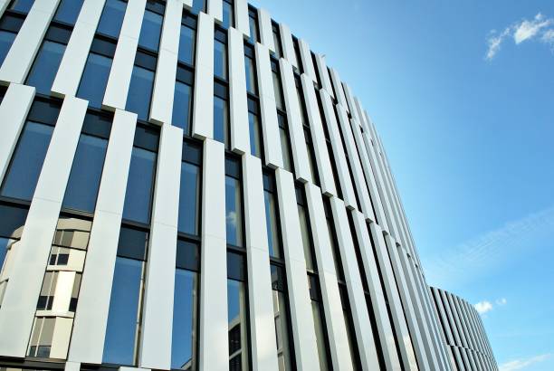 istock Modern building. Modern office building with facade of glass 693875382