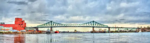 Photo of Panorama of Jacques Cartier Bridge crossing the Saint Lawrence River in Montreal, Canada