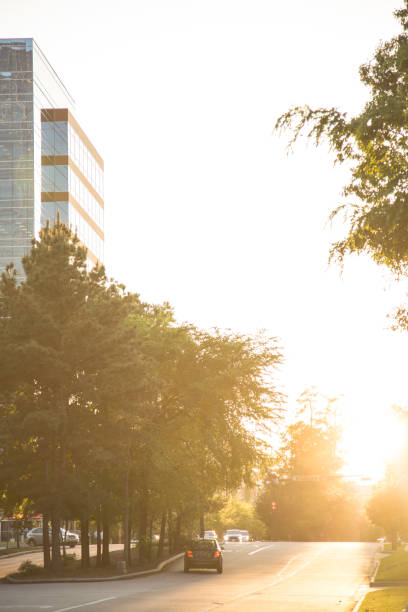 istock Sunset on downtown city road with skyscraper. 693881476