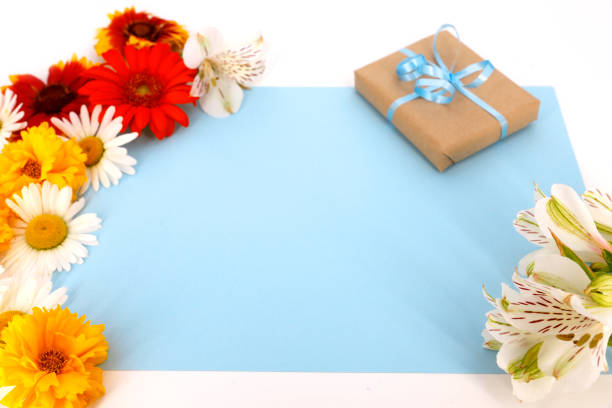 istock Floral background with gift box and paper for text 693883764