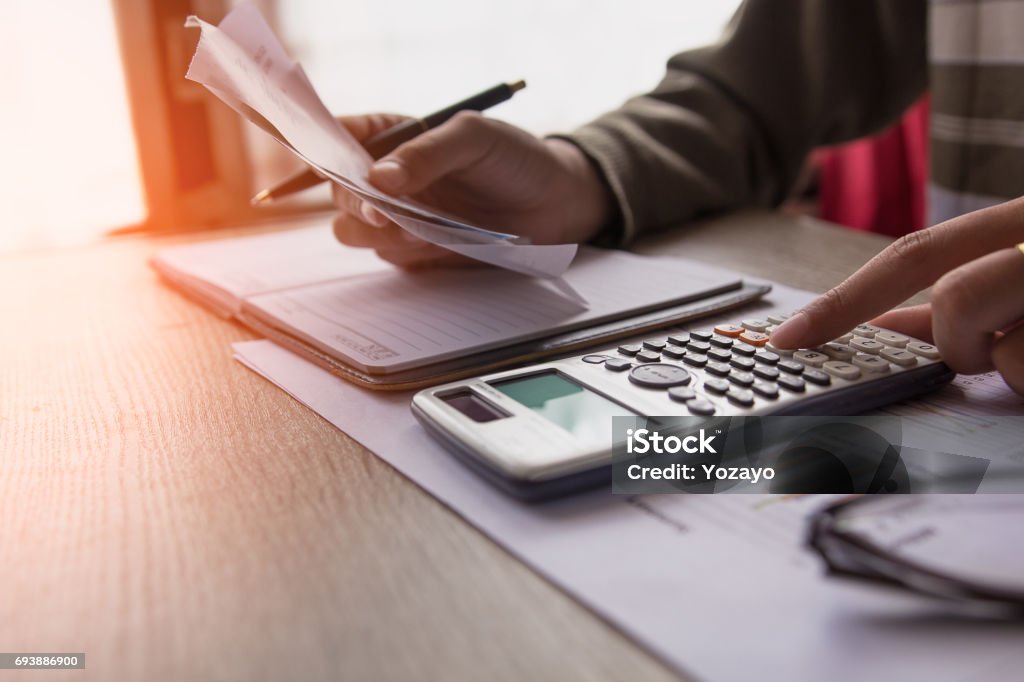 people calculate about cost at home ,Finance managers task,Concept business and finance Calculator Stock Photo