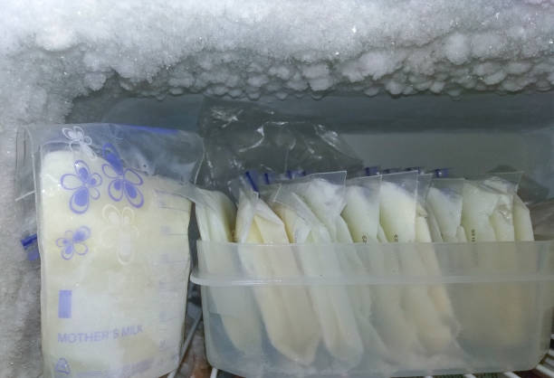 frozen breast milk breast milk packed in storage bags, frozen in the fridge breast milk stock pictures, royalty-free photos & images
