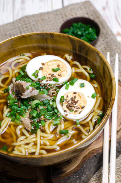 istock Ramen noodles with eggs, meat and green onion 693893982