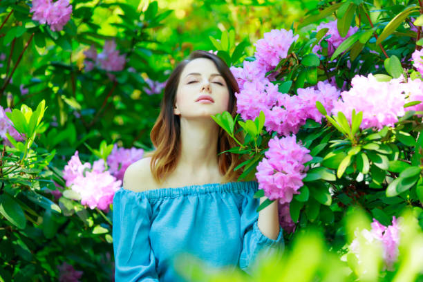istock Red-haired woman in garden 693897016