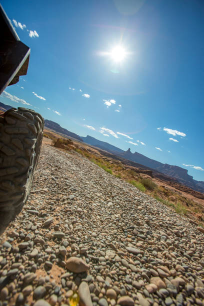 istock Offroad gravel with sun flare 693897342