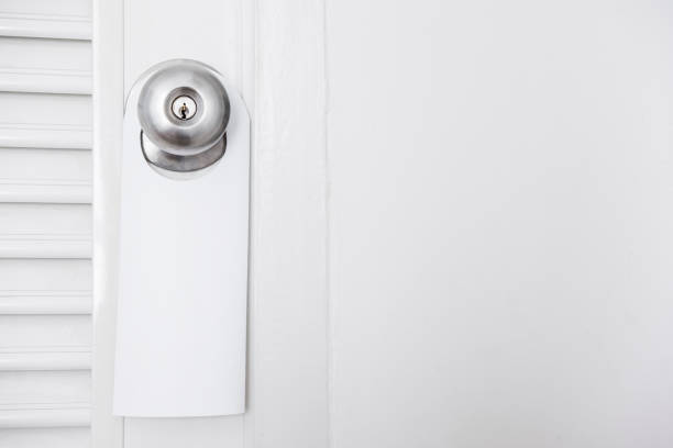 istock Door closed with empty hanging sign plate 693904524