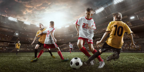 istock Soccer kids players in action in 3D dramatic stadium 693905310