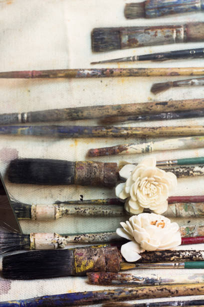 istock Artistic scene with old painter's brushes 693905640