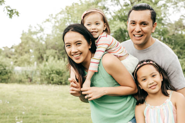 Happy family having fun outdoor Happy family outdoor happy filipino family stock pictures, royalty-free photos & images
