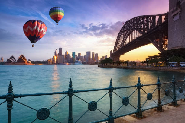 Hot air balloon over Sydney bay in evening, Sydney, Australia Hot air balloon over Sydney bay in evening, Sydney, Australia ballooning festival stock pictures, royalty-free photos & images