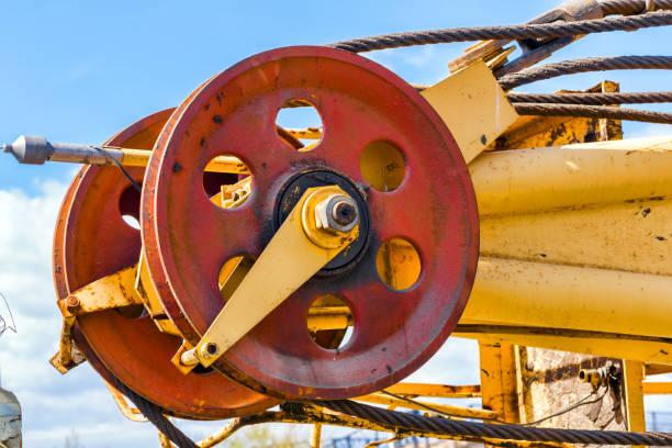 istock Crane jib with blue sky in background 693925016