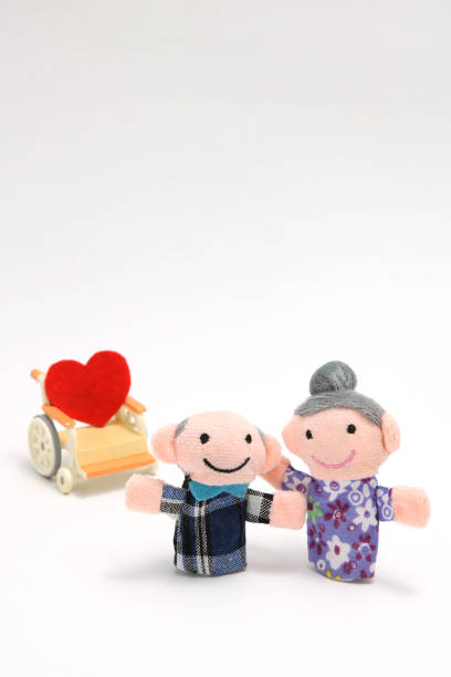 istock Elderly people with wheelchair on white background. 693928946