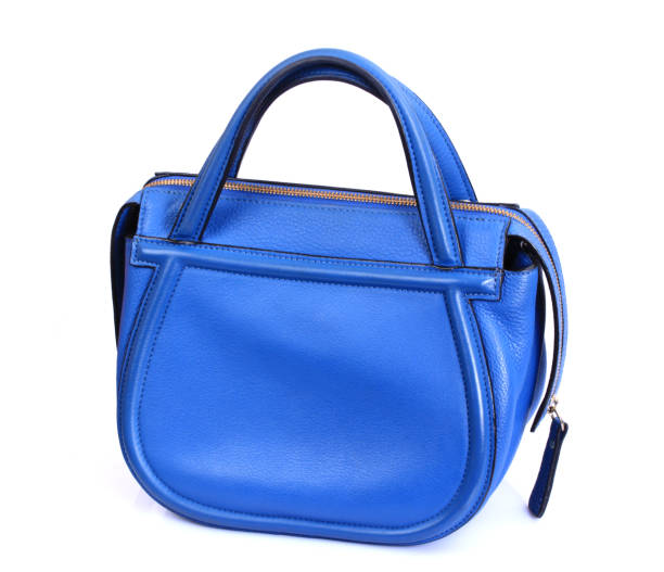 istock Blue leather Women's handbag on white background 693934328