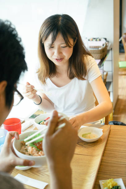 istock Young Japanese couple having lunch 693934656