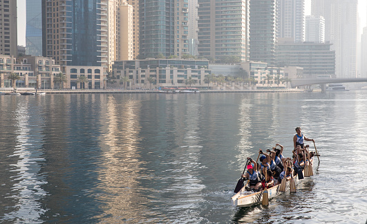 Dubai, UAE, June 2nd, 2017: draggon boat team practicing in dubai marina