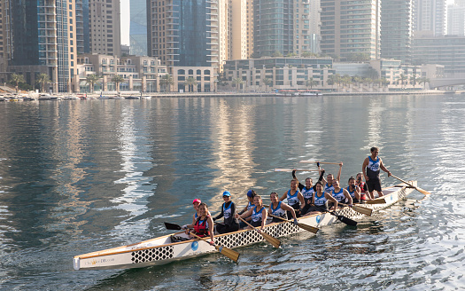 Dubai, UAE, June 2nd, 2017: draggon boat team practicing in dubai marina