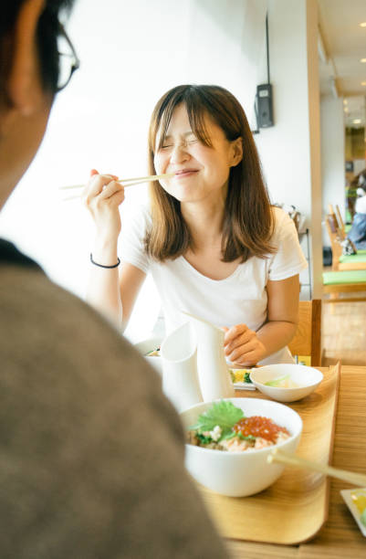 istock Young Japanese couple having lunch 693940944