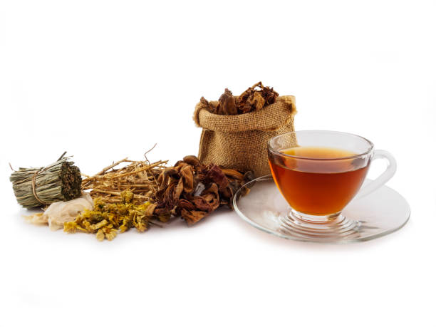 Herbal tea cup and dried herbal medicine on white background