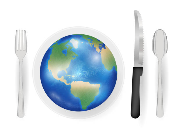 istock earth planet on a dish with knife fork and spoon eat world concept 693941158