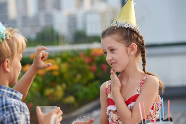 istock Chatting with Friend at Birthday Party 693956854