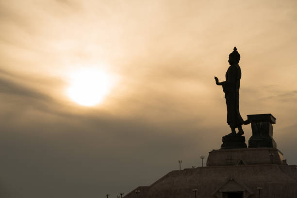 istock silhouette of buddha statue with sunset 693958974