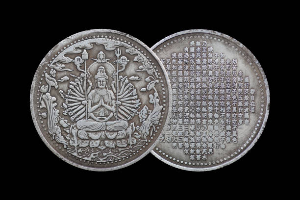 istock Old Chinese coin with guanyin isolated on black background. 693962420