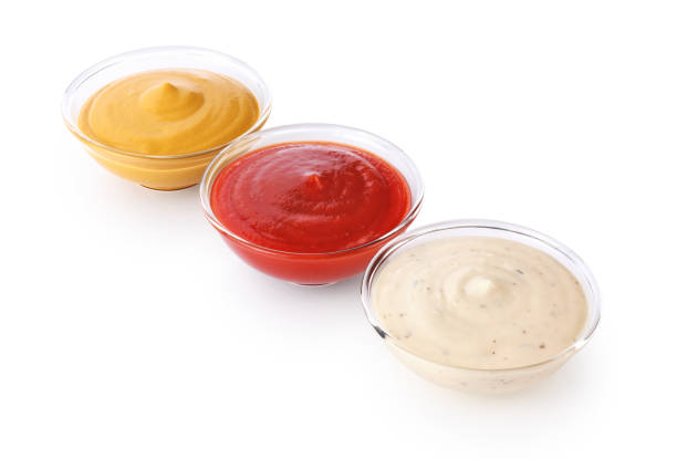 istock Bowls with ketchup mustard and mayonnaise isolated on white background. 693967354