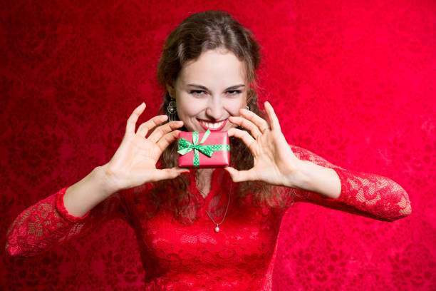 istock Beautiful woman with valentines day gift box present surprise 693968366