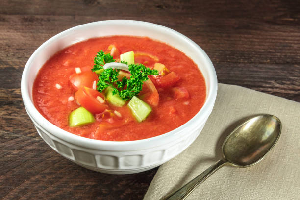 istock Bowl of gazpacho soup on rustic texture with copyspace 693974990