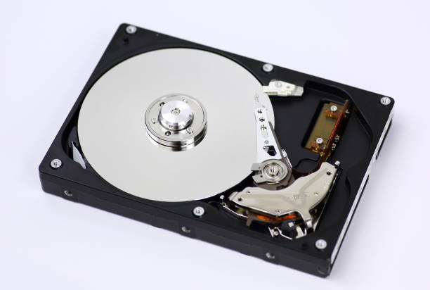 istock Harddisk drive (HDD) with top cover open on white background. 693975440