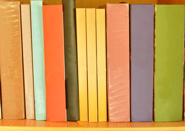 istock colorful book arrange on wooden shelf 693975628