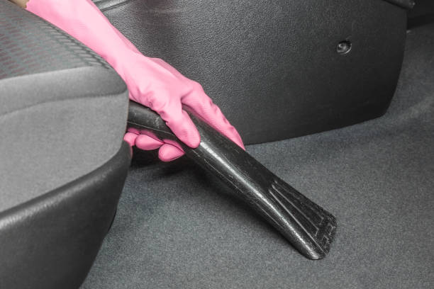 istock Before chemical cleaning process a professionally nozzle releasing car floor from dust and sand. Early spring cleaning or regular clean up. 693979992