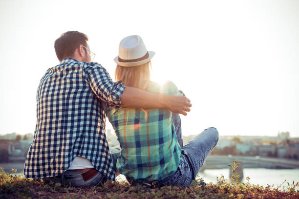 istock Young couple enjoying the sunset 693980342