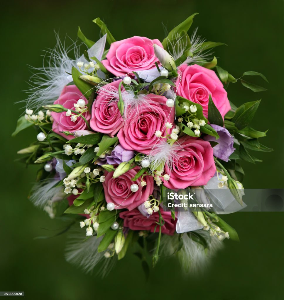 Wedding bouquet Wedding bouquet from roses on a green background Adult Stock Photo