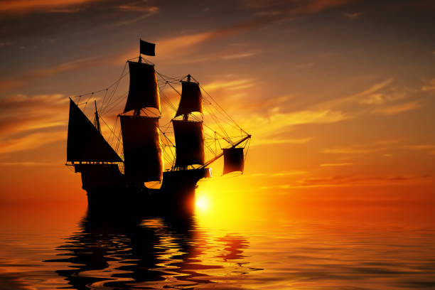 istock Old ancient pirate ship on peaceful ocean at sunset. 694000466