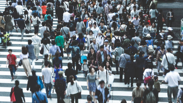 istock Asian People are across the crosswalk 694003304