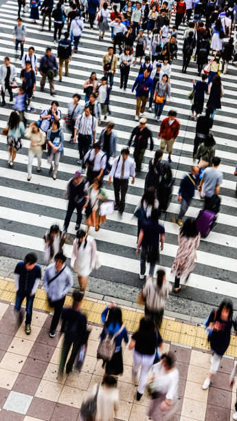 istock Asian People are across the crosswalk 694003734