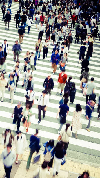 istock Asian People are across the crosswalk 694004034