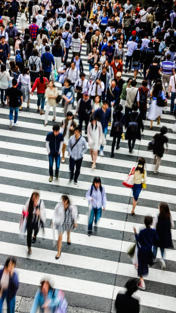 istock Asian People are across the crosswalk 694004400