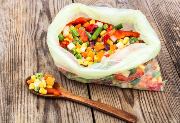 istock Frozen mixture of vegetables, isolated on white 694004580