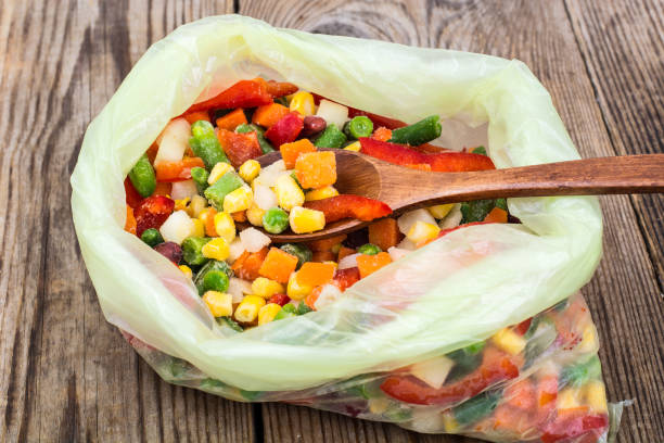istock Frozen mixture of vegetables, isolated on white 694004648