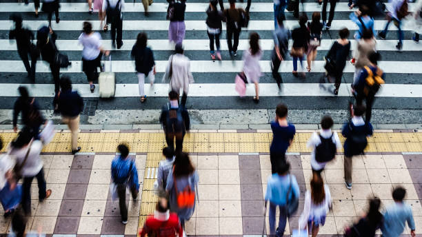 istock Asian People are across the crosswalk 694004678