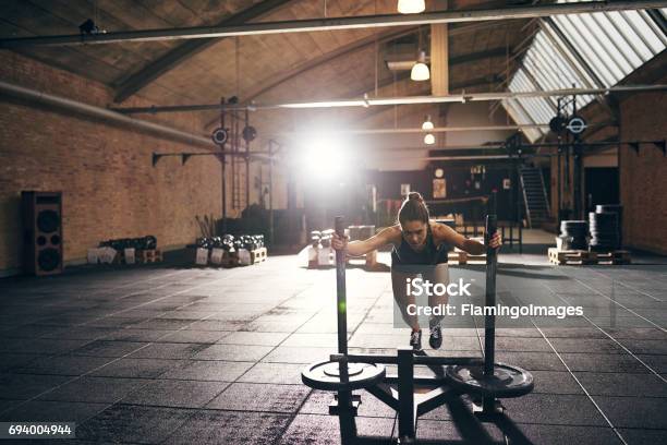 Woman Doing Hard Pushup Exercise In Gym Stock Photo - Download Image Now - Athlete, Gym, One Woman Only