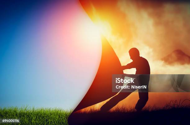 Man Pulling Curtain Of Darkness To Reveal A New Better World Change Stock Photo - Download Image Now