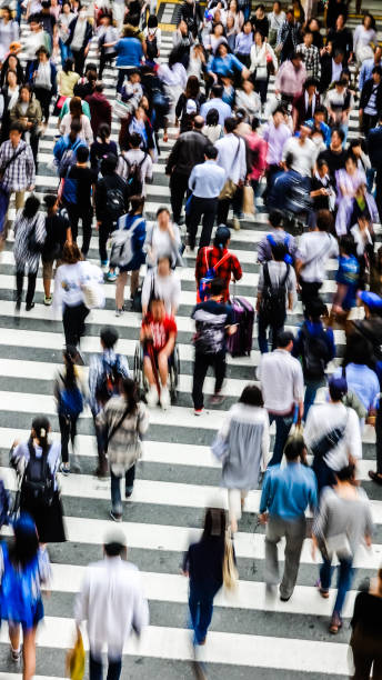 istock Asian People are across the crosswalk 694005124
