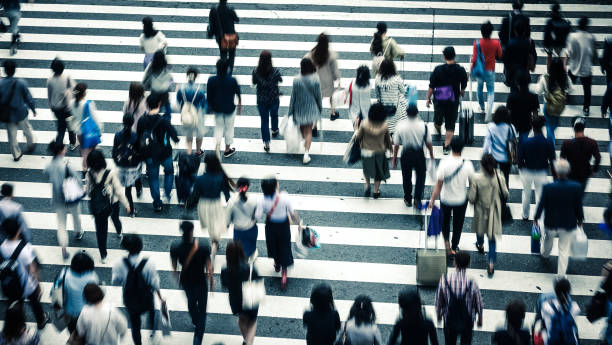 istock Asian People are across the crosswalk 694005158