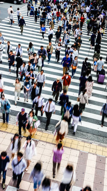 istock Asian People are across the crosswalk 694005298