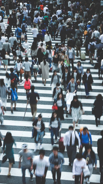 istock Asian People are across the crosswalk 694008164