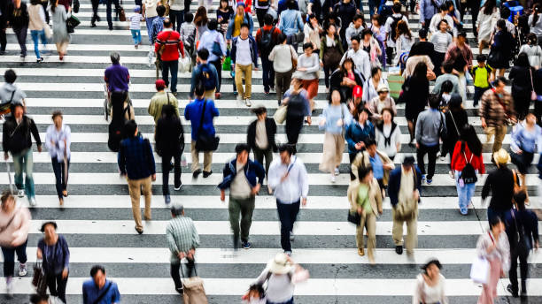 istock Asian People are across the crosswalk 694008476