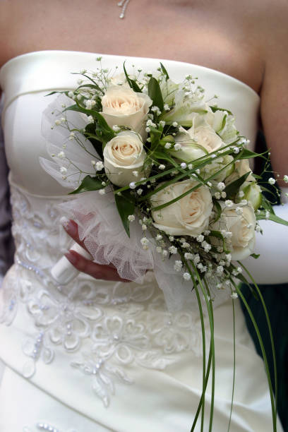 istock Wedding bouquet in hands of the bride 694012762